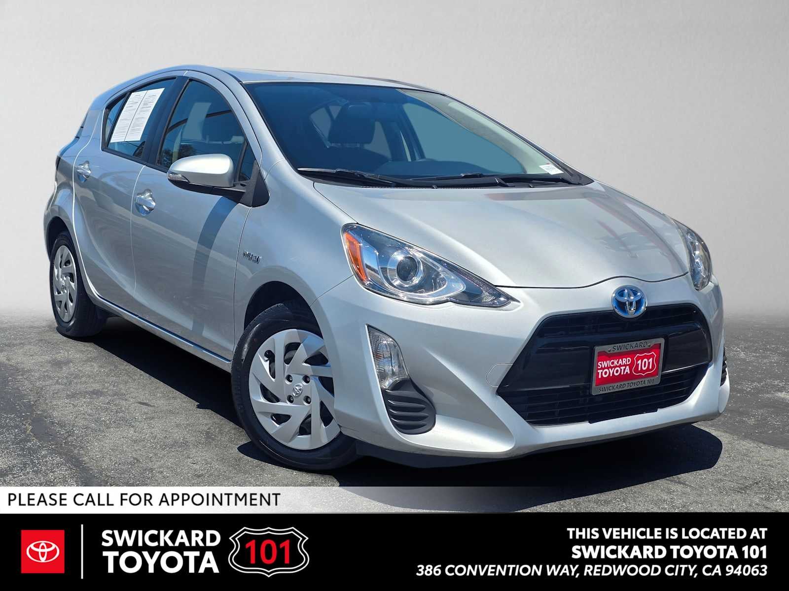 2016 Toyota Prius c Two in Classic Silver Metallic — front three-quarter view